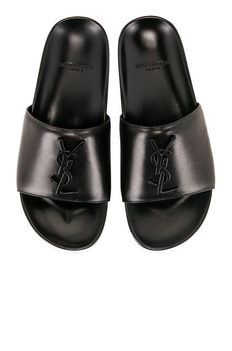 Yves Saint Laurent Joan Leather Slides .